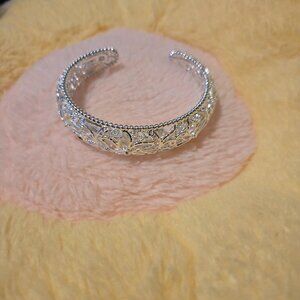 New, elegant, and adjustable silver colored open bracelet